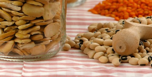 Uncooked Legumes and Grains with Wooden Scoop