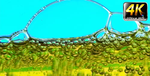 Yellow Liquid and Bubbles on Blue Background