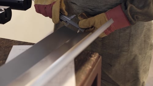 Industrial Worker Inspector Measuring Detail With Vernier Caliper