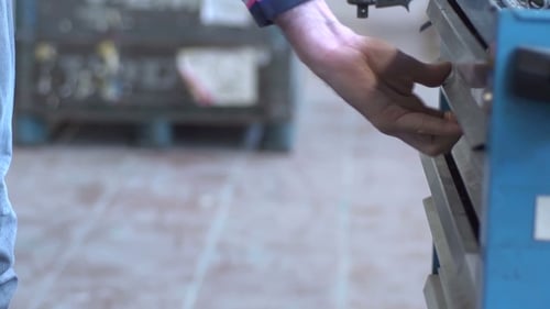 The Man Opens The Toolbox