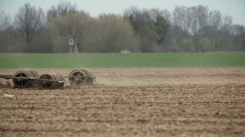 Agricultural Tractor Sowing And Cultivating Field