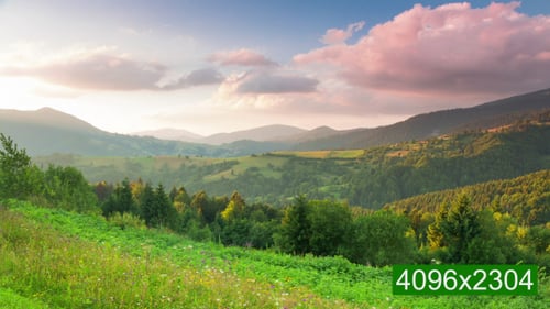 Rolling Hills Landscape Under Pink Sunrise Sky
