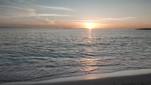 Sunset and Rolling Waves