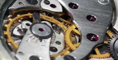 Mechanical Watch Gears Spinning in Close Up