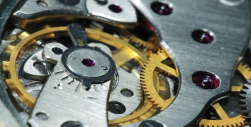 Intricate Timepiece Gears Turning Inside Watch