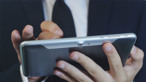 Man in Suit Using Tablet Close Up