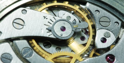 Clockwork Gears Turning in Intricate Timepiece Mechanism