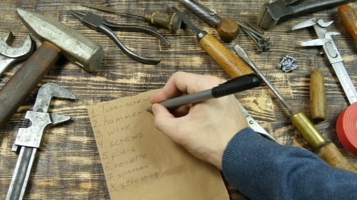 Man's Hand List Out The Tools, Flat Lay