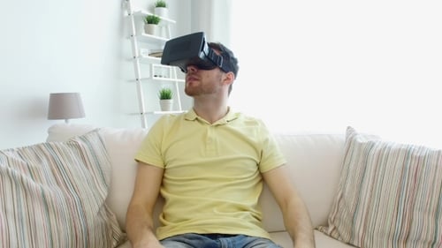 Man Experiencing Virtual Reality on Couch