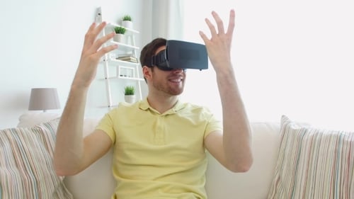 Man In Virtual Reality Headset Playing Game