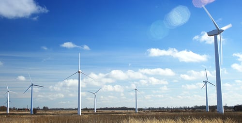 Wind Turbines in Rural Field Turning on Sunny Day