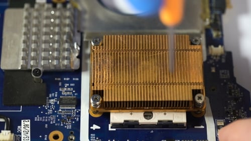 Tightening Screws on a Computer Circuit Board