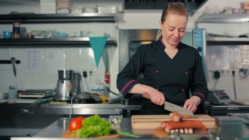 Chef Cutting Sausages