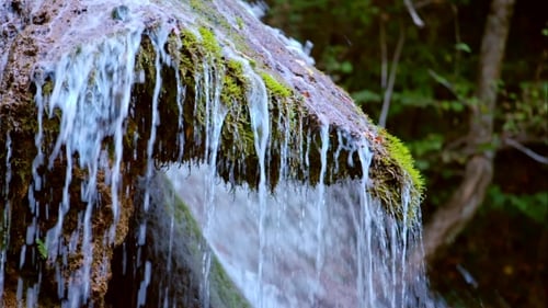 Beautiful Waterfall Flowing Down The Cliff