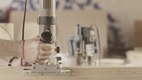 Carpenter Careful Cut Wooden Board By Plunge Router. Treatment. Straight Line