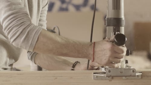 Man Using Power Tools in Workshop, Carpentry