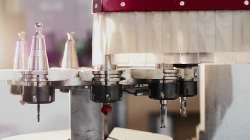 Automatic Change of Milling Heads in Modern CNC Machining Center