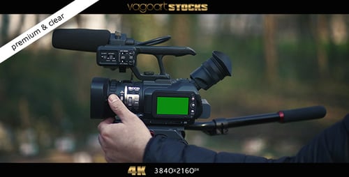 Adjusting Professional Video Camera with Green Screen