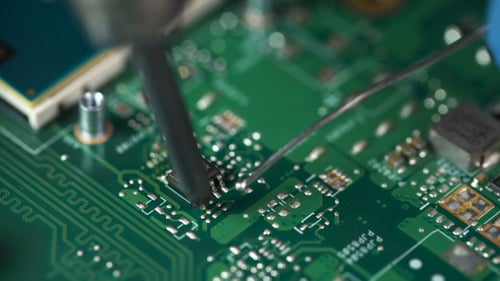 Electronic Lab Working Place With Soldering Iron And Circuit Board