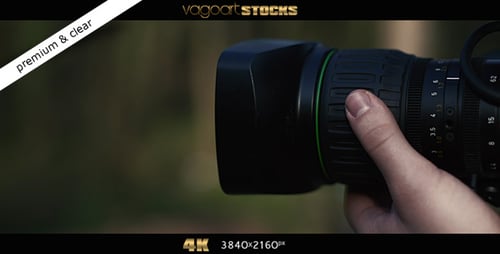 Camera Lens Adjustment on Nature Background