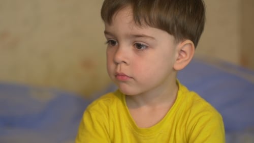 Small Boy 3 Years Looking Into The Camera Depicting Various Emotions