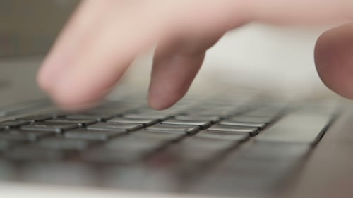 Typing On Laptop