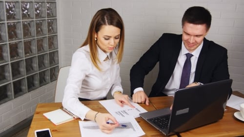 Business People Having Meeting Around Table In Modern Office