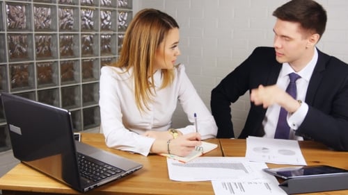 Business People Having Meeting Around Table In Modern Office