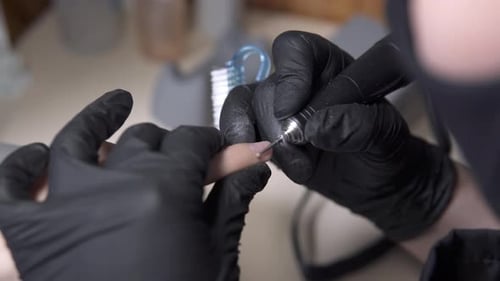 Manicurist Filing Nails Close Up