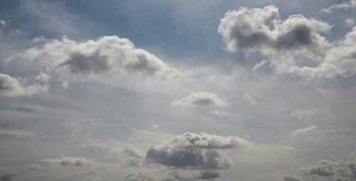 Clouds Moving Slowly Through the Sky on Sunny Day