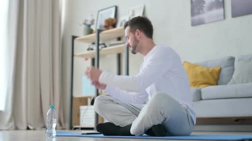Man Listening Music on Headphones and Meditating