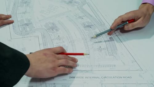 Engineers Planning the Building Construction – Architectural Drawing