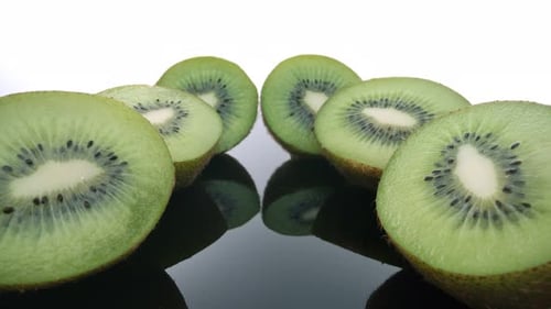 Close Up of Sliced Kiwi Fruit on Black