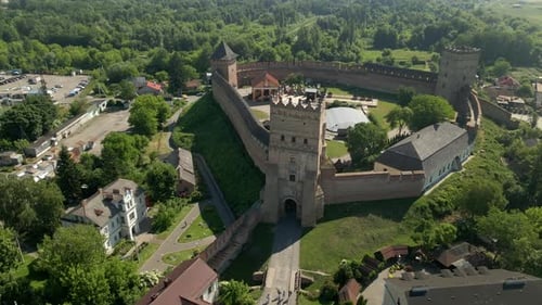 Drone Flies Over Small Medieval Castle on Mountain in Small European City at Summer Sunny Day Lutsk