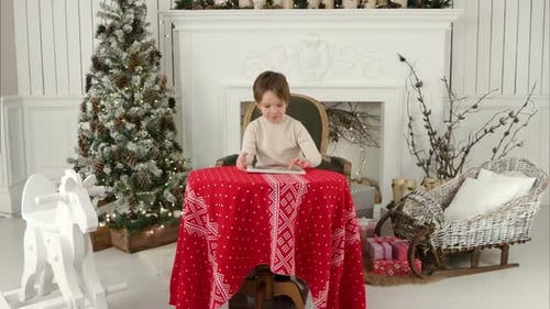 Young Boy Using Tablet at Christmas Time