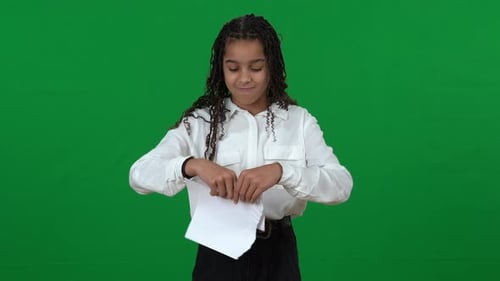 Stressed Angry Teen Girl Tearing Paper on Green Screen Crossing Hands