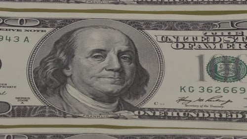 Stacks of One Hundred Dollar Bills Close Up