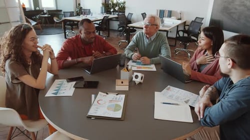 Diverse Team Collaborating in Modern Office Meeting