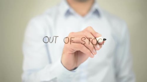 Man Writes "Out of Stock" on Clear Surface