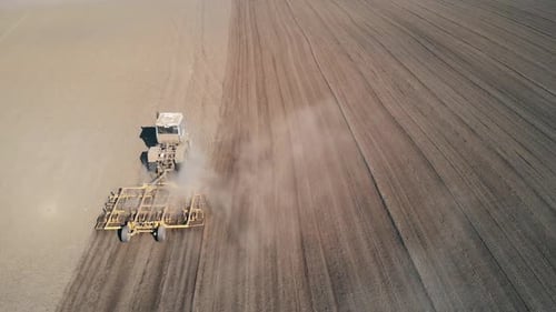 Tractor Processes Field