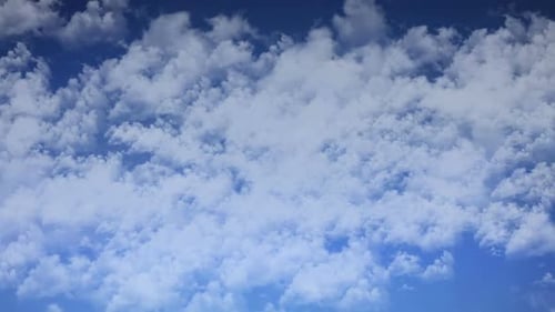 Time Lapse of Fluffy White Clouds Drifting Across a Blue Sky