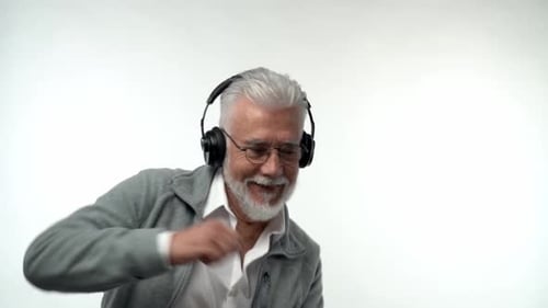 Energetic Senior Man Dancing to Music