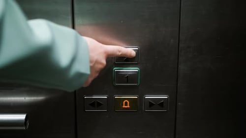 Finger Pressing Elevator Button Up in Office Center Mall or Hotel
