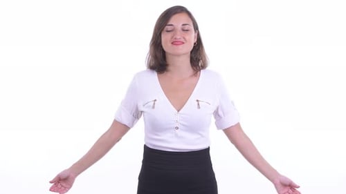 Woman Practices Breathing Exercises in Studio