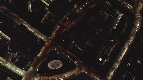 Nighttime Aerial View of a Modern Illuminated City