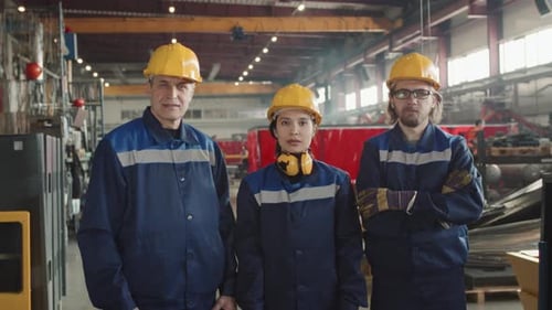 Portrait Of Plant Workers Posing For Camera