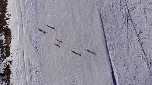 Aerial flight above mountain ski resort Сable car lifts in