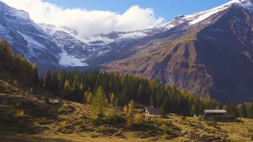 Snowy Mountains and Autumn Forest Aerial View