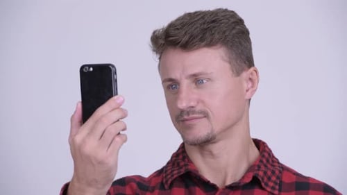 Man Using Smartphone, Smiling and Talking