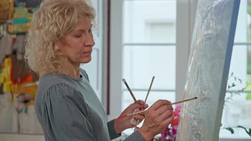 Woman Painting Art on Canvas Indoors